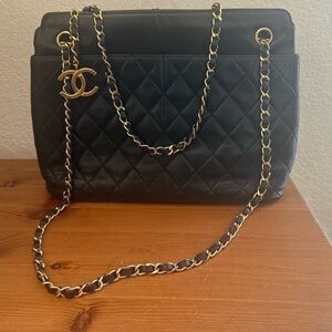 Authentic vintage Chanel, black leather shoulder bag series one with CoA